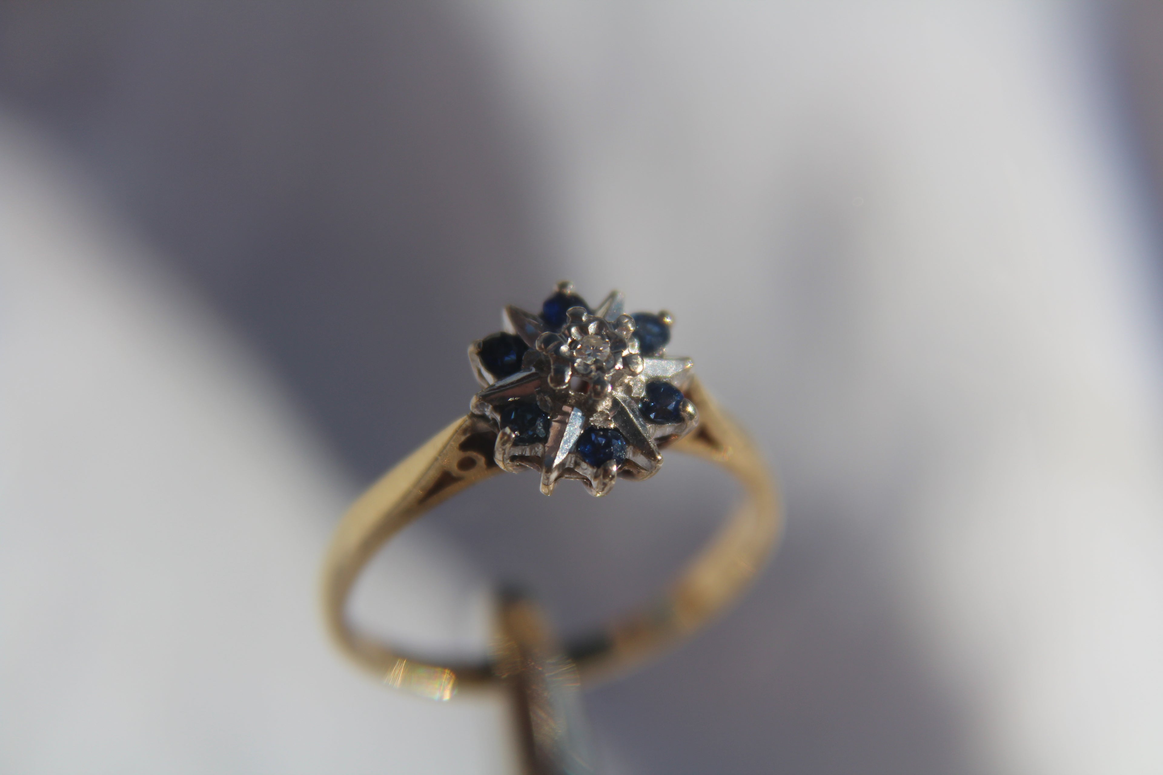 Antique Designer Ring with Sapphire and Diamond set in 18K Yellow Gold with Platinum Accents.